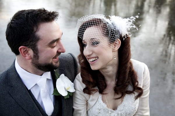 Bride smiling at groom - Picture by Olivia Shaw Photography