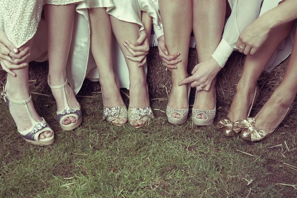 Bride and bridesmaids legs showing their bridal shoes - Picture by Ian Shoots Weddings