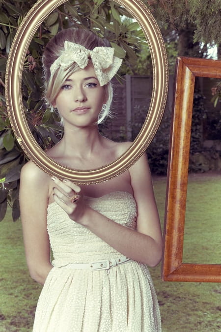 Bridesmaid posing with picture frame - Picture by Ian Shoots Weddings