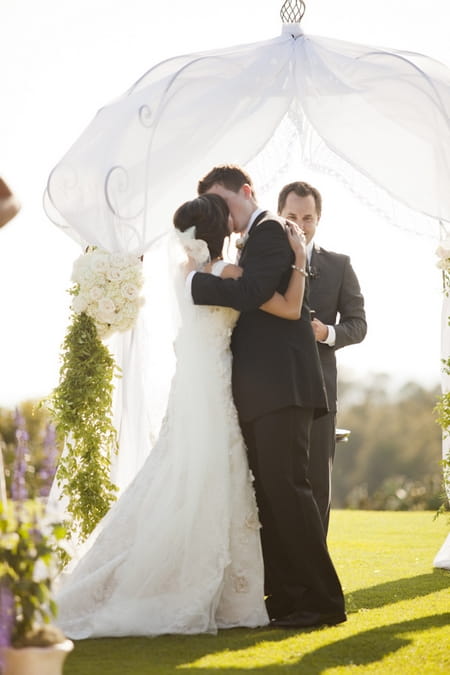 Bride and groom first kiss - Picture by Allyson Magda Photography