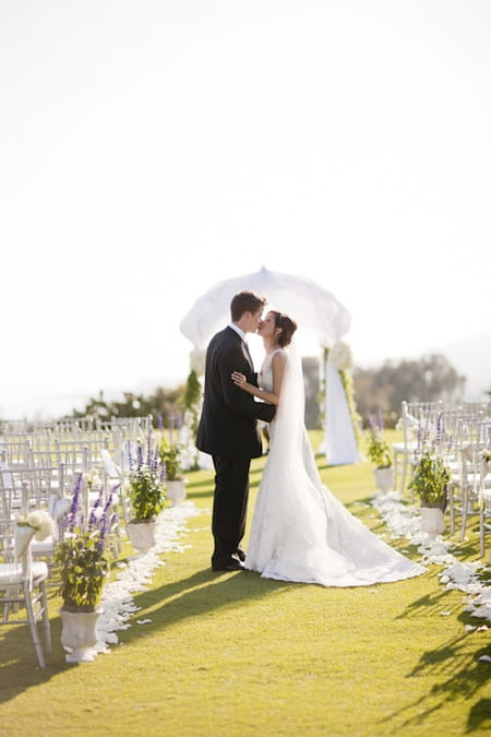 Bride and groom kissing - Picture by Allyson Magda Photography