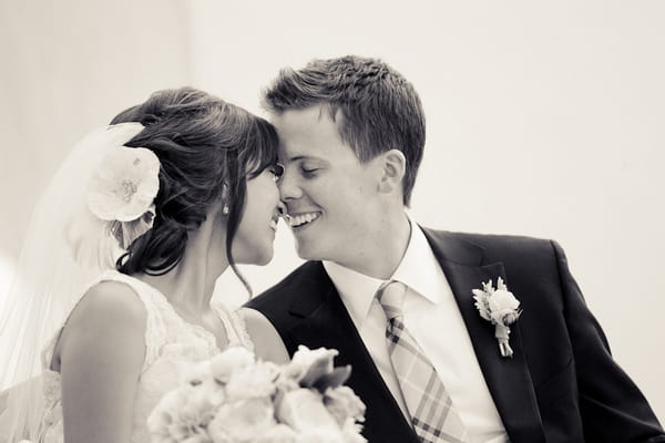 Bride and groom touching noses - Picture by Allyson Magda Photography