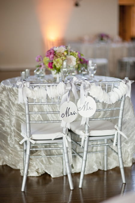 Chairs with Mr and Mrs signs - Picture by Allyson Magda Photography