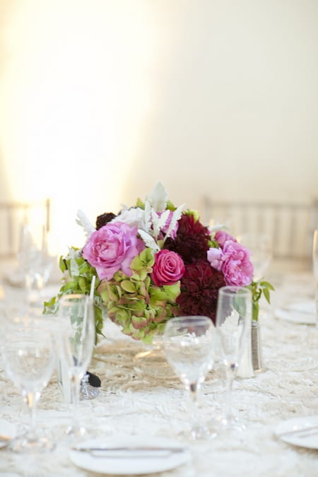 Pink wedding table centre flowers - Picture by Allyson Magda Photography