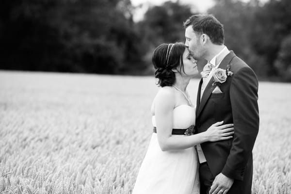 Groom kissing bride on the head - Picture by Hayley Ruth Photography