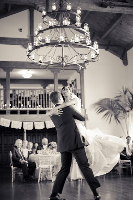 Groom lifting bride during wedding dance - Picture by Allyson Magda Photography