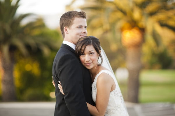 Bride hugging groom - Picture by Allyson Magda Photography