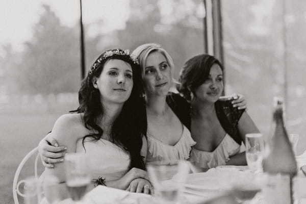 Bridesmaids with arms around each other - Picture by Jonas Peterson Photography