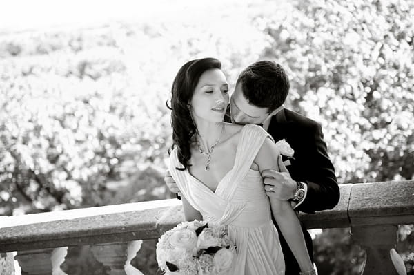 Groom kissing brides neck - Picture by Gill Maheu Photography