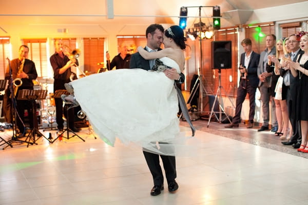 Groom picking up bride during first dance - Picture by Hayley Ruth Photography