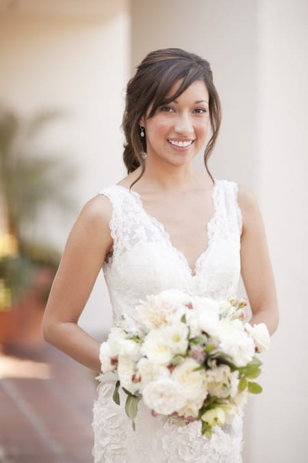 Bride smiling with bouquet - Picture by Allyson Magda Photography