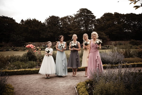 Bridesmaids posing in coloured dresses - Picture by Archibald Photography