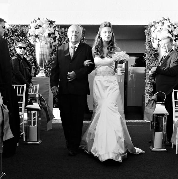 Bride walking with father into wedding ceremony - Picture by Yvette Roman Photography