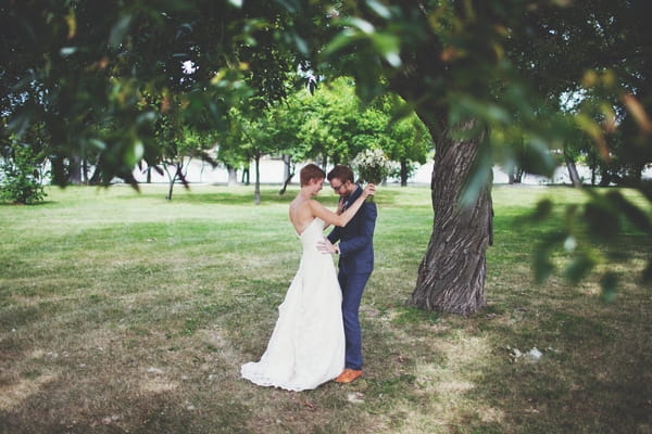 Bride and groom under a tree - Picture by Josh Dookhie Photography