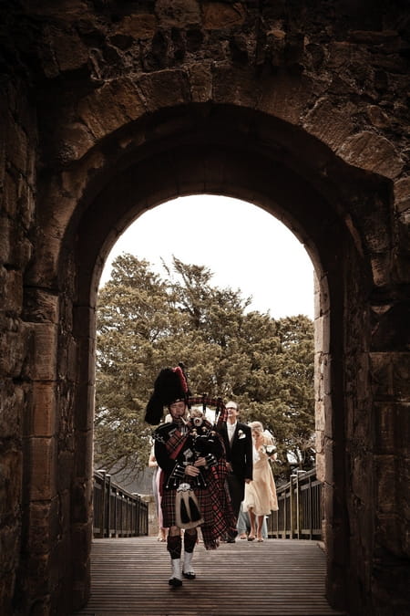 Bagpipe player leading bride and father to wedding - Picture by Archibald Photography
