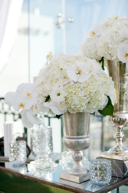 Silver vase of wedding flowers - Picture by Yvette Roman Photography