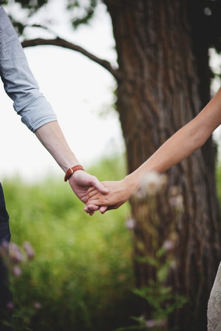 Close-up of bride and groom holding hands - Picture by Josh Dookhie Photography