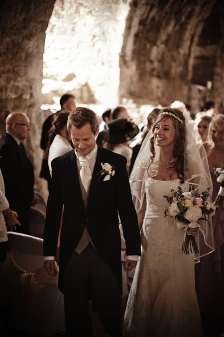 Newly married bride and groom leaving wedding ceremony - Picture by Archibald Photography
