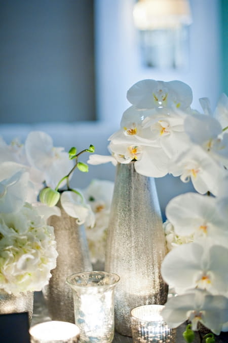 Orchid wedding table flowers - Picture by Yvette Roman Photography