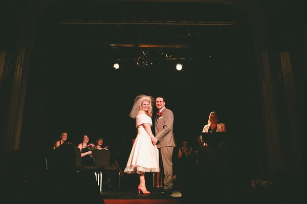 Newly married bride and groom smile at guests - Picture by McKinley-Rodgers Photography