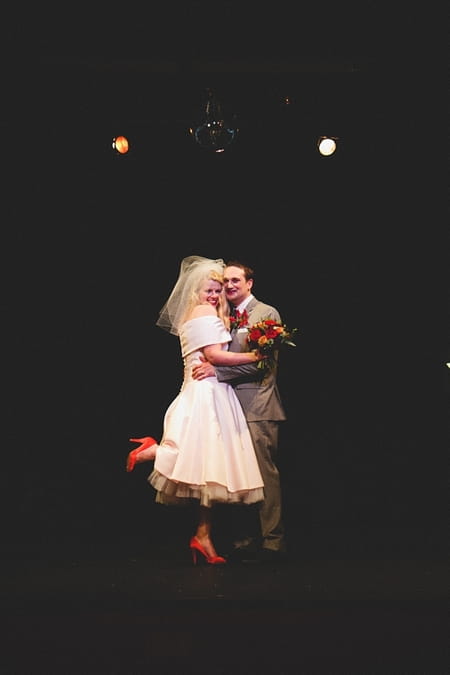 Bride and groom smiling on stage at The Lantern Theatre - Picture by McKinley-Rodgers Photography