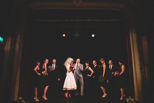 Bridal party posing on stage at The Lantern Theatre - Picture by McKinley-Rodgers Photography