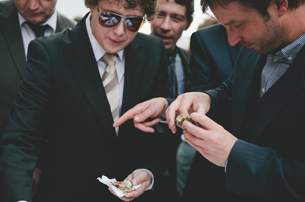 Wedding guests eating oysters - Picture by McKinley-Rodgers Photography