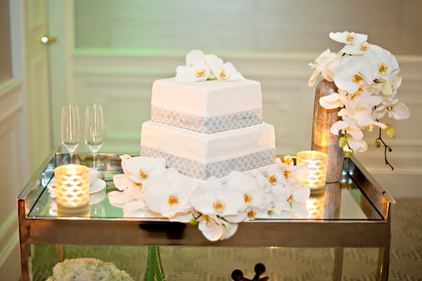 Wedding cake and orchids - Picture by Yvette Roman Photography