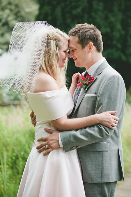 Bride and groom touching their heads - Picture by McKinley-Rodgers Photography