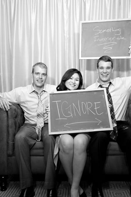 Wedding guests with chalk board message - Picture by Yvette Roman Photography