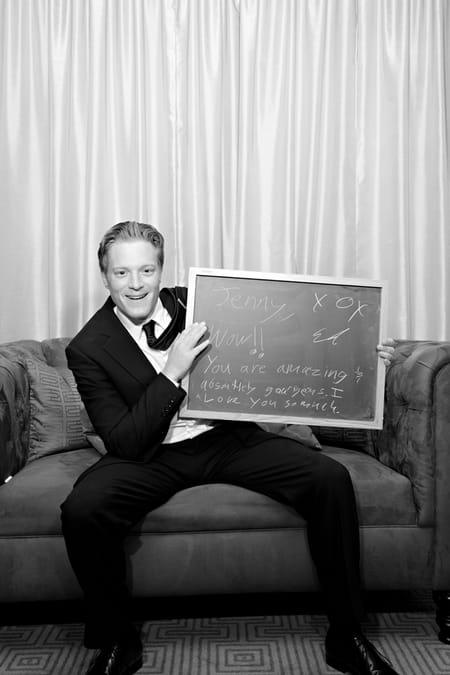 Groom with chalk board message - Picture by Yvette Roman Photography