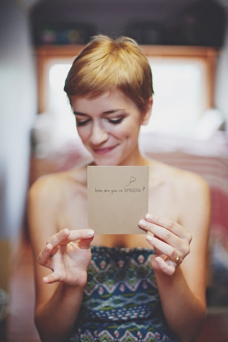 Bride holding card saying How are you so amazing? - Picture by Josh Dookhie Photography