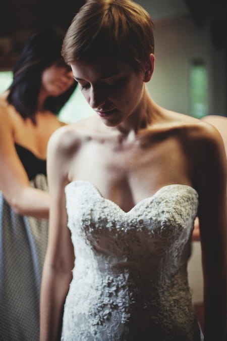 Bride putting on her wedding dress - Picture by Josh Dookhie Photography