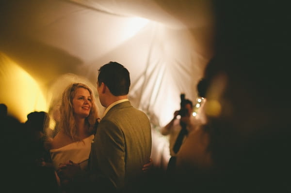 Bride and groom looking at each other on dance floor - Picture by McKinley-Rodgers Photography