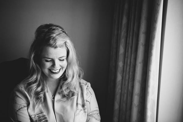 Bride smiling before wedding - Picture by McKinley-Rodgers Photography