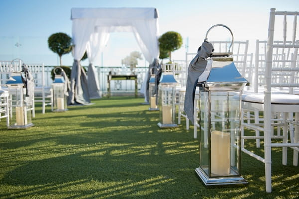 Lamps next to wedding ceremony seating - Picture by Yvette Roman Photography