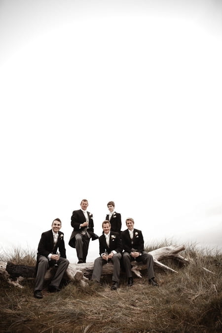 Groomsmen sitting on a fallen tree - Picture by Archibald Photography