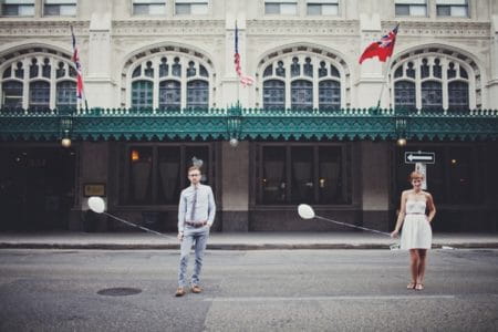 Vintage bride and groom holding balloons - Picture by Josh Dookhie Photography
