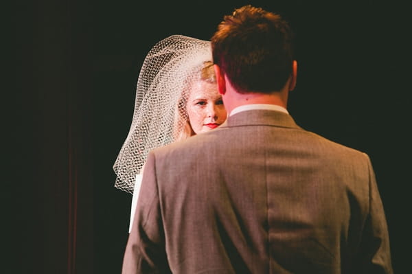 View of bride over groom's shoulder - Picture by McKinley-Rodgers Photography