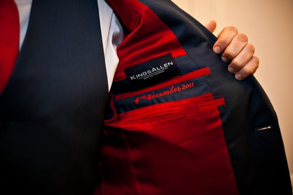 Red lining in wedding suit jacket - Picture by Anneli Marinovich Photography