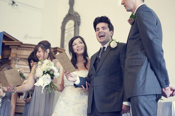 Bride and groom singing in wedding ceremony - Picture by Mirrorbox Photography