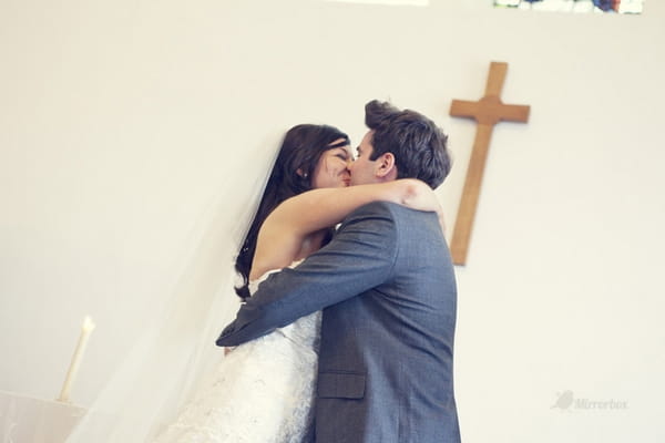 Bride and groom kissing after being married - Picture by Mirrorbox Photography