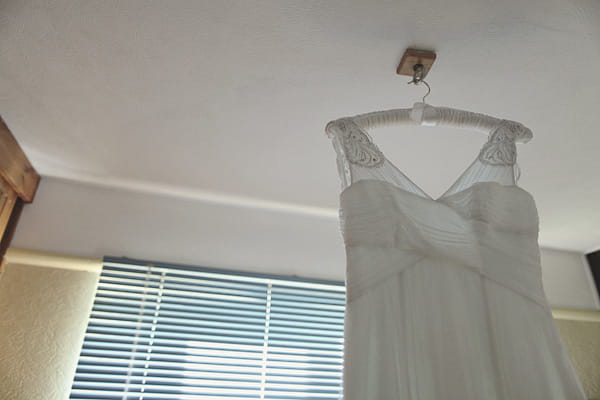 Wedding dress hanging from ceiling - Picture by York Place Studios