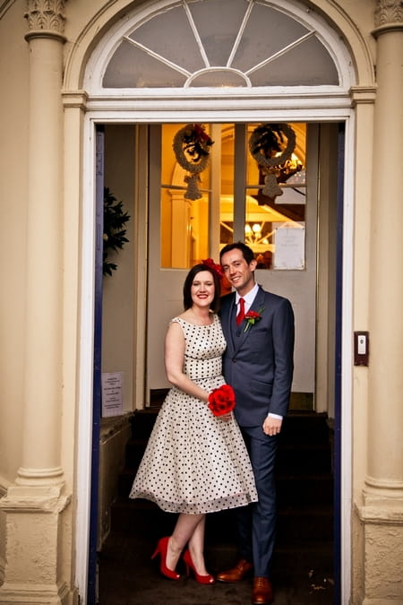 Bride with blue polka dot dress with groom in blue suit - Picture by Anneli Marinovich Photography