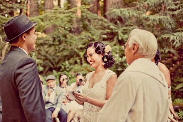 Bride laughing during vintage wedding ceremony - Picture by Paco and Betty