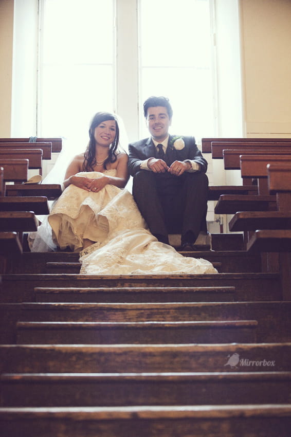 Bride and groom sitting in town hall - Picture by Mirrorbox Photography