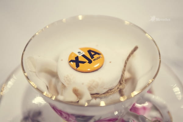 XJA Music badge in a china cup - Picture by Mirrorbox Photography