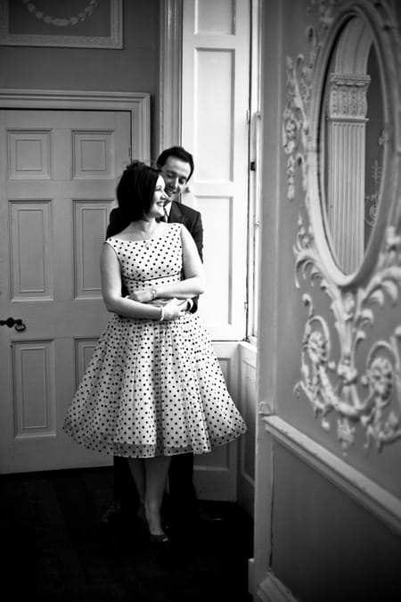 Groom with arms around bride's waist - Picture by Anneli Marinovich Photography