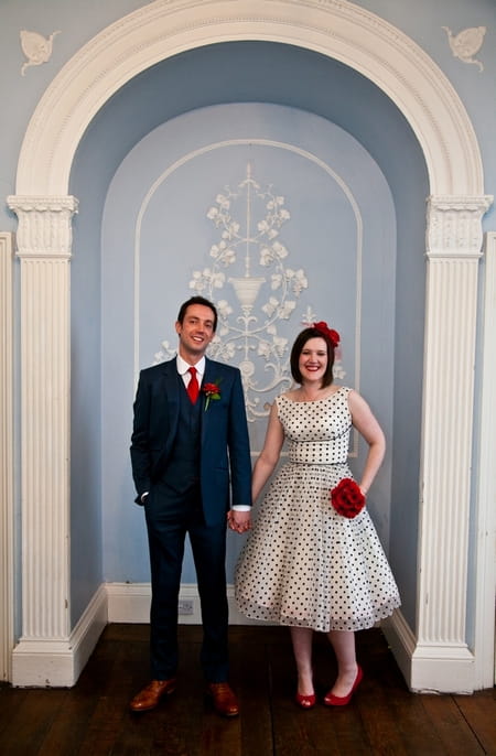 Bride and groom standing in arch - Picture by Anneli Marinovich Photography