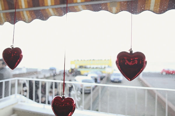 Red hearts hanging in window - Picture by York Place Studios